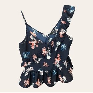 Navy blue blouse with cross ruffle detail and floral print